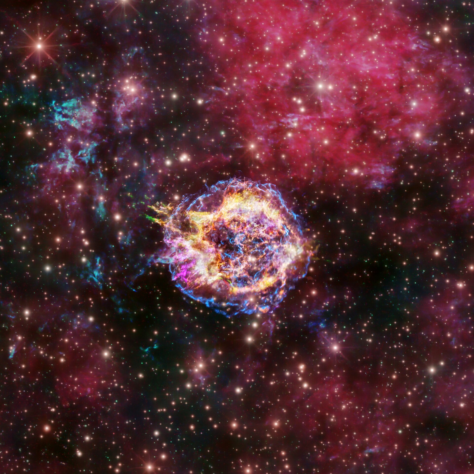 Nebulosa rojiza rodea una burbuja brillante entre estrellas